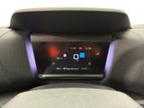 the dashboard of a car with a digital display on the back of it