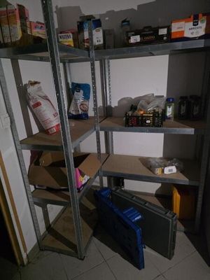a shelf that has many items on it in the room