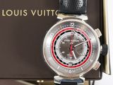 a black watch with a red second hand on a black strap