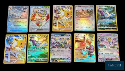 Les cartes Pokémon sont alignées sur une surface noire.