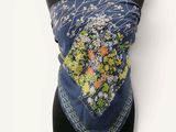 a close up of a scarf on a mannequin torso
