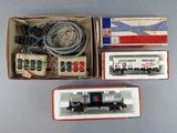 two boxes with different types of toy trains in them