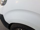 a white van parked on the side of the road