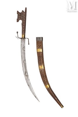 a close up of a knife with a wooden handle on a white background