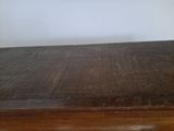 a wooden table with a clock on top of it