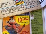 a newspaper with a cartoon character on it and a magazine with a cartoon character on it
