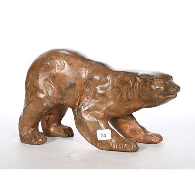 bronze sculpture of a polar bear on a white background