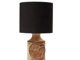 the table lamp has a black shade on top of it