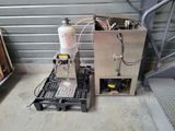 a machine that is sitting on a pallet next to a box