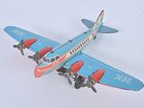 a toy airplane that is sitting on a white surface