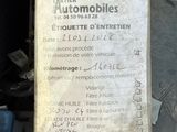 a sign that is attached to a car ' s engine