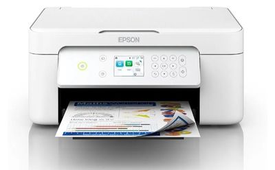 the printer is sitting on top of a white table