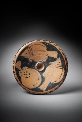 an old black and white vase with a bird on it