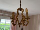 a chandelier hanging from the ceiling in a room