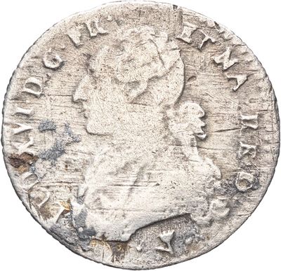 gros plan d'une pièce de monnaie sur fond blanc