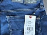 the jeans are blue and have a price tag on them