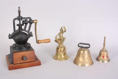 three different types of bells and a coffee grinder on a table