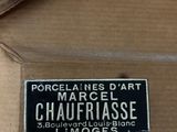 a box with a label on it that says marcel d ' art chaufflassee