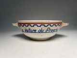 an image of a bowl sitting on top of a white table