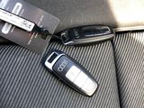 two flip phones sitting on the back seat of a car