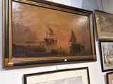 de nombreuses photos accrochées au mur de cette pièce