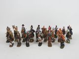 figurines of soldiers on horses and riders in uniform