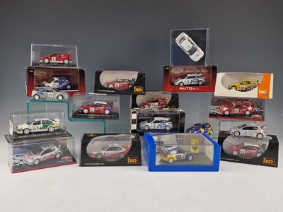 many different models of cars in a display case