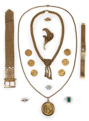 an assortment of gold jewelry including a necklace, bracelet, and ring