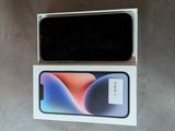 an open box with a phone inside of it sitting on a table