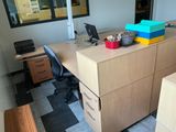 a desk with a computer on it in an office