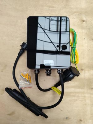 an overhead view of a cell phone connected to a charger