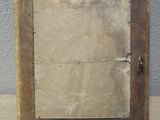 an old wooden picture frame with a piece of paper on it