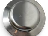a silver plate on a white surface with a white background