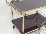 a small cart with a glass top and a metal frame