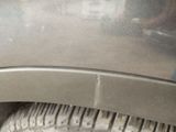 a close up of a tire on a car ' s rim