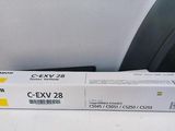 deux boîtes d'encre jaune Canon CEX-28 posées sur une table