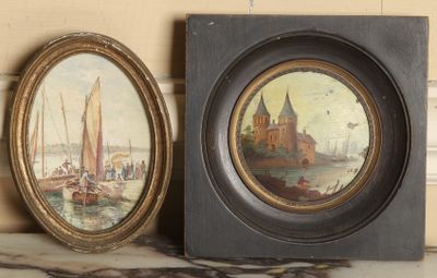 two framed pictures of boats on a table