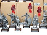 a lot of statues that are on display in front of boxes