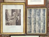 many framed pictures on the wall of this room