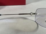 a pair of glasses sitting on a table with a red box in the background