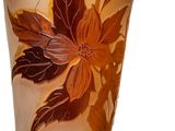a glass vase with a floral design on it