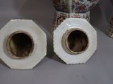two vases sitting next to each other on a table