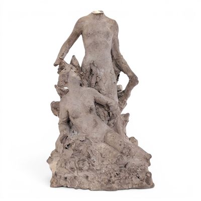 statue of a man and a dog on a rock