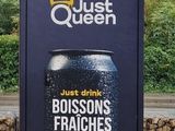 a sign that says just queen with a crown on it