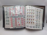 an open book that has a bunch of stamps on it