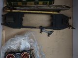 a box with a toy train and other items in it