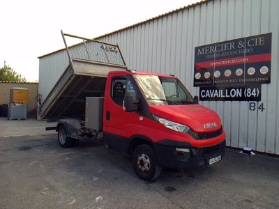 a red truck that is parked in front of a building