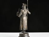 an image of a statue of a man holding a staff