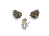 a group of three diamond and gold - plated brooches