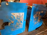 two pieces of blue metal that are sitting on a table